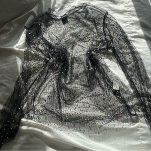 See through shirt. I wore this as a dress!